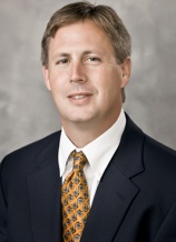 A man in suit and tie posing for the camera.